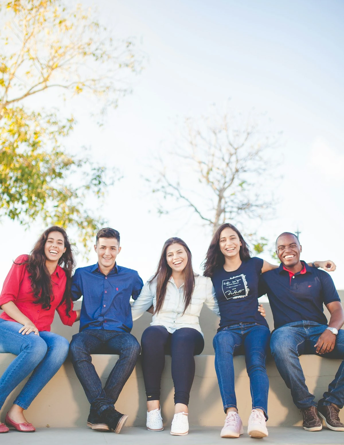 Diverse group of Kingdom Foundation College students sitting together outdoors