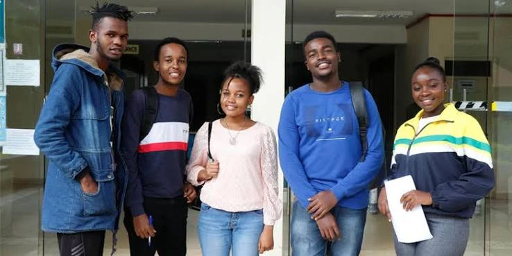 Five Kingdom Foundation College students standing together and smiling on campus