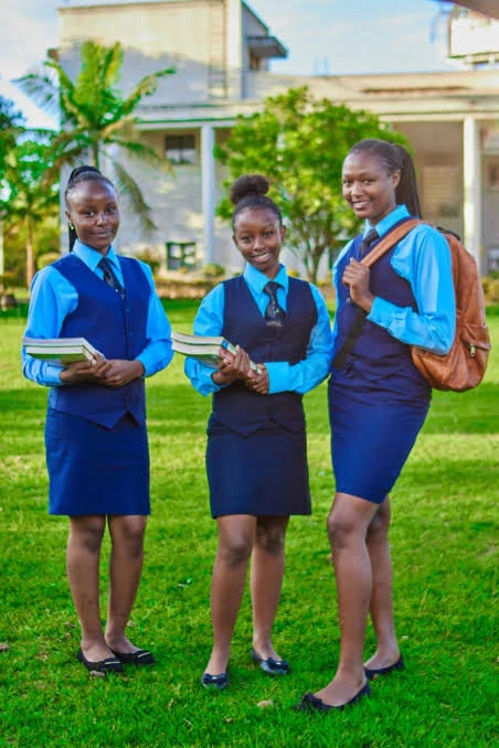 Three Kingdom Foundation College students in uniform on the campus lawn